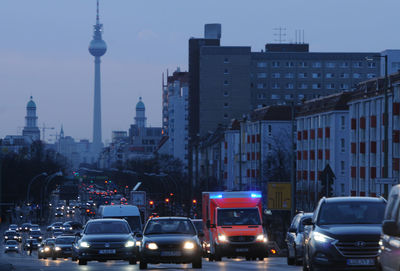 Traffic on city street with buildings in background