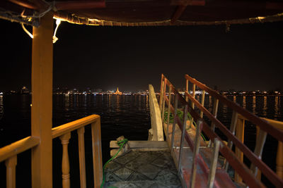 Illuminated buildings at waterfront