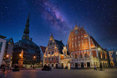 Illuminated buildings in city at night