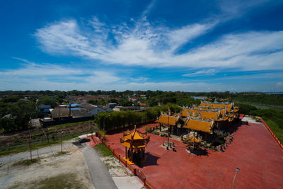High angle view of houses and trees against sky