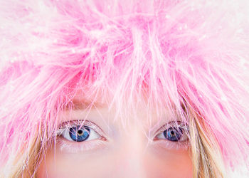 Close-up portrait of girl with pink hair