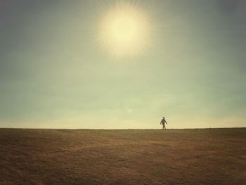 Scenic view of desert against sky during sunset