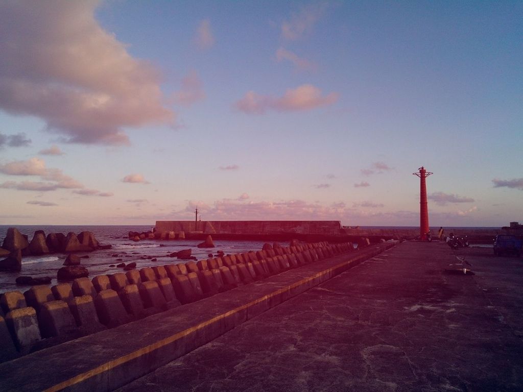 sky, sea, water, cloud - sky, sunset, built structure, the way forward, horizon over water, beach, pier, architecture, tranquility, tranquil scene, nature, scenics, cloud, outdoors, incidental people, building exterior, dusk