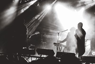 People performing on stage during concert