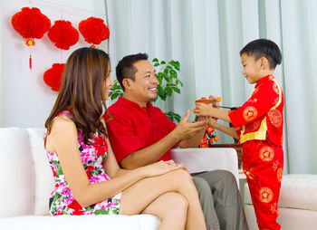 Happy family celebrating chinese new year at home