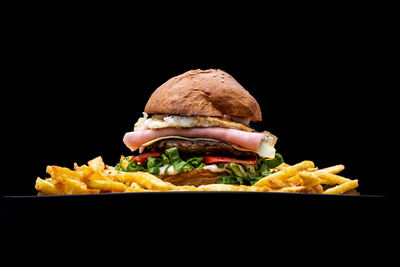 Close-up of food on table against black background