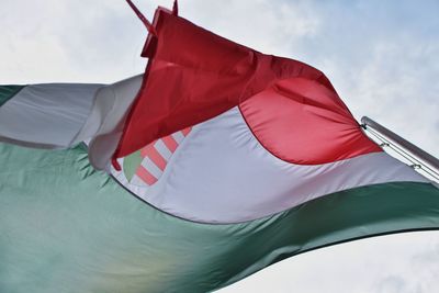 Low angle view of flag against the sky