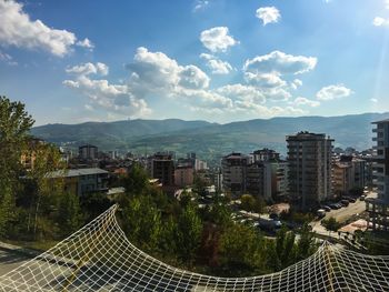 High angle view of buildings in city against sky