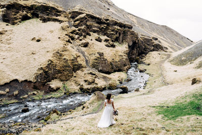 Woman standing on rock