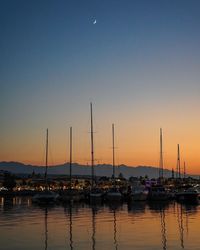 Boats moored at harbor