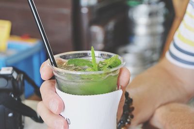 Close-up of hand holding drink
