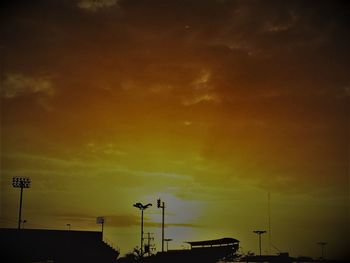 Low angle view of silhouette street light against sky during sunset