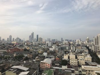 High angle view of buildings in city against sky