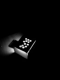 Close-up of electric lamp against black background