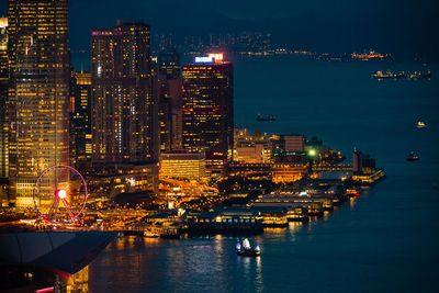 Illuminated buildings in city at night