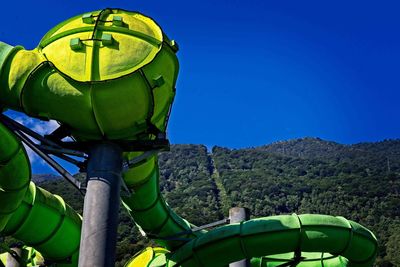 Green landscape against clear blue sky