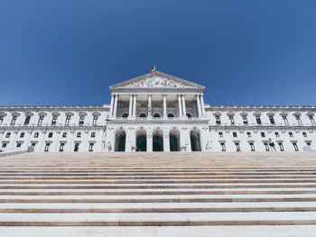 Low angle view of building against blue sky