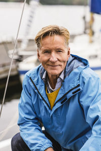 Portrait of confident senior man attending boat master course