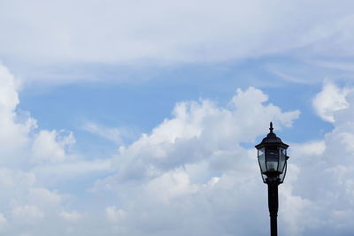 Low angle view of street light against sky