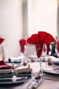 Close-up of red rose on table in restaurant