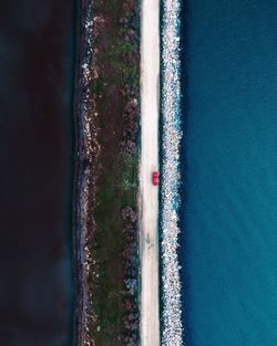 Aerial view of road amidst sea