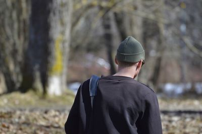 Rear view of man standing in park