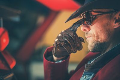 Close-up of man adjusting sunglasses