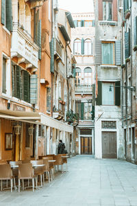 Empty alley amidst buildings in city