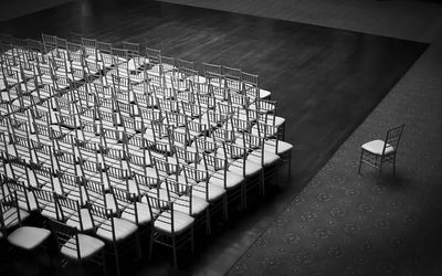 High angle view of empty chairs on floor in auditorium