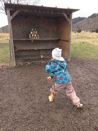Low section of person standing by plants