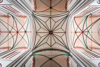 Low angle view of multi colored ceiling of building