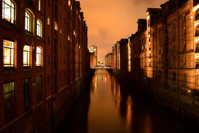 Canal in city at night