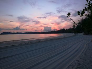 Scenic view of beach against sky during sunset