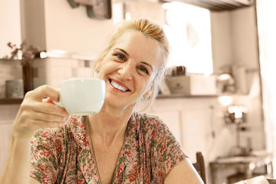 Portrait of a woman drinking coffee