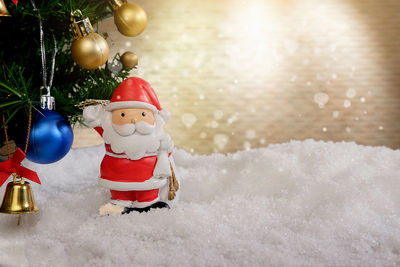 Close-up of christmas decorations on snow