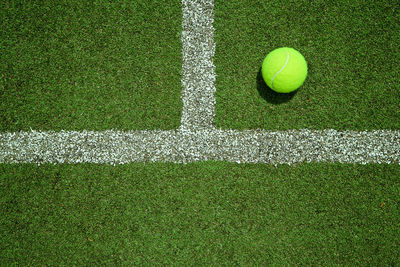 High angle view of tennis ball on field in court