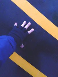 Close-up of person standing on bed