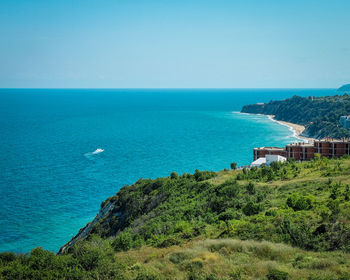 Scenic view of sea against clear blue sky