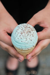 Close-up of hand holding ice cream