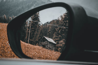 Reflection of car on side-view mirror