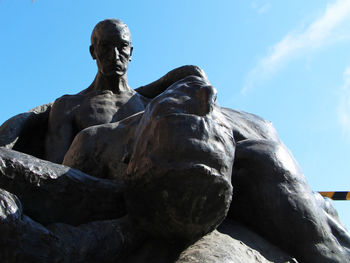 Low angle view of statue against sky