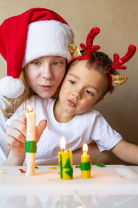 Portrait of cute girl playing with toys on table