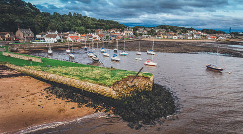 Boats moored at harbor