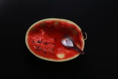 Close-up of strawberry over black background