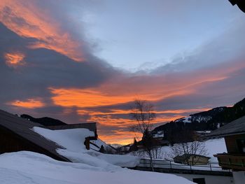 Scenic view of snowcapped mountains against sky during sunset