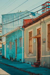 Exterior of old building by street against sky