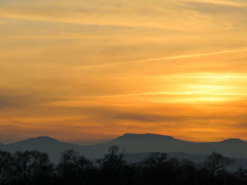 Scenic view of mountains at sunset