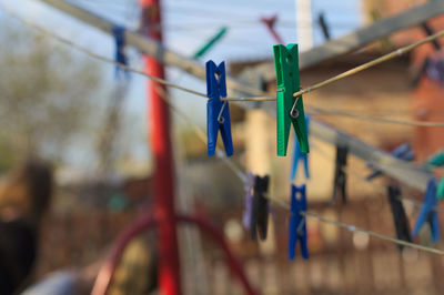 Clothespins hanging on clothesline