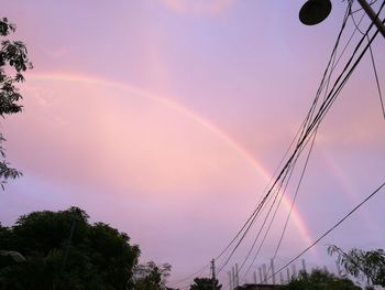 Low angle view of rainbow against sky