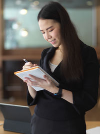 Young woman using mobile phone